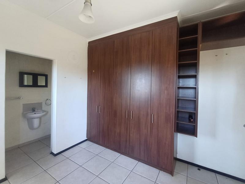 15599443